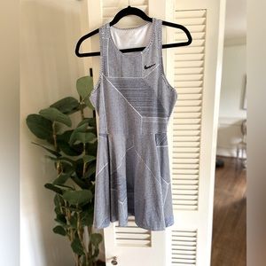 Nike Dri Fit Tennis Dress in asymmetrical navy and white stripes. Size small.